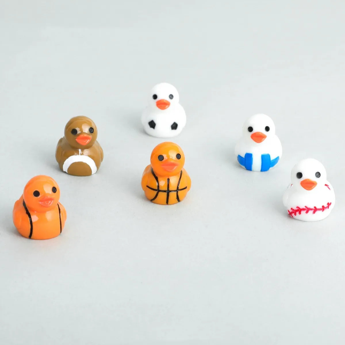 The Ball Duck desk decorative figurines 50/100PCS mini ducks Resin Car decorative DIY Accessories Football Basketball duck